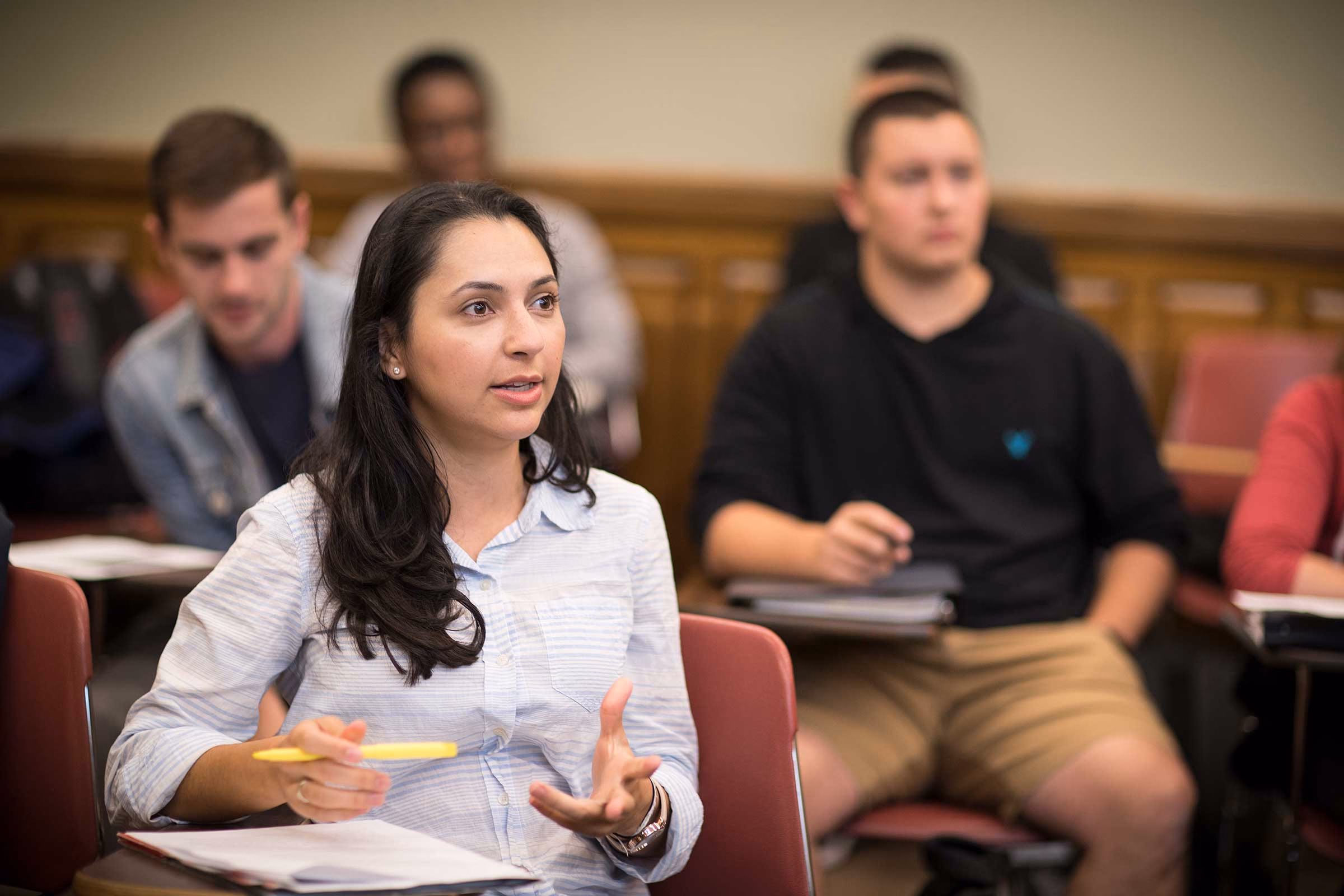 An MPA student participating in a classroom discussion