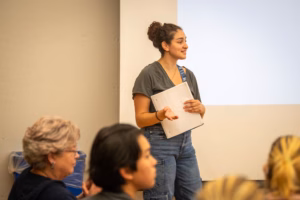 A Clark student developing public speaking skills, making a presentation