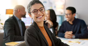 woman smiling at conference table