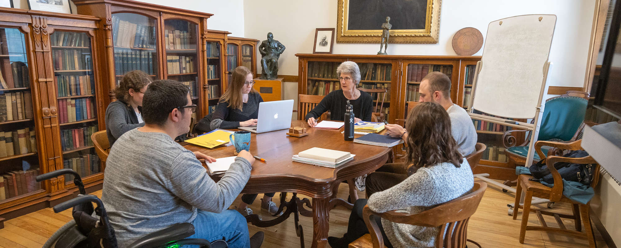graduate students in classroom around table