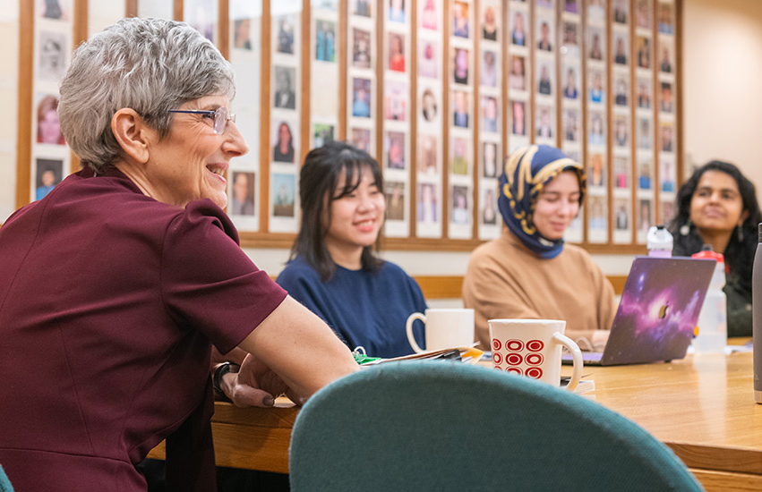 Nancy Budwig with graduate students in classroom