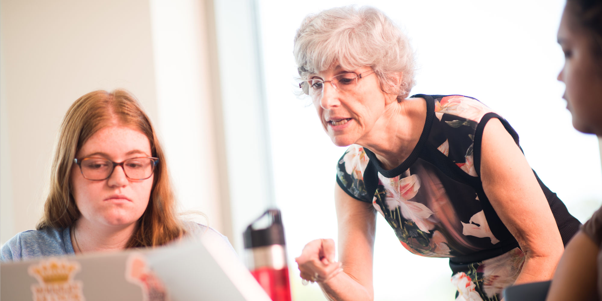 Nancy Budwig working with students on class work