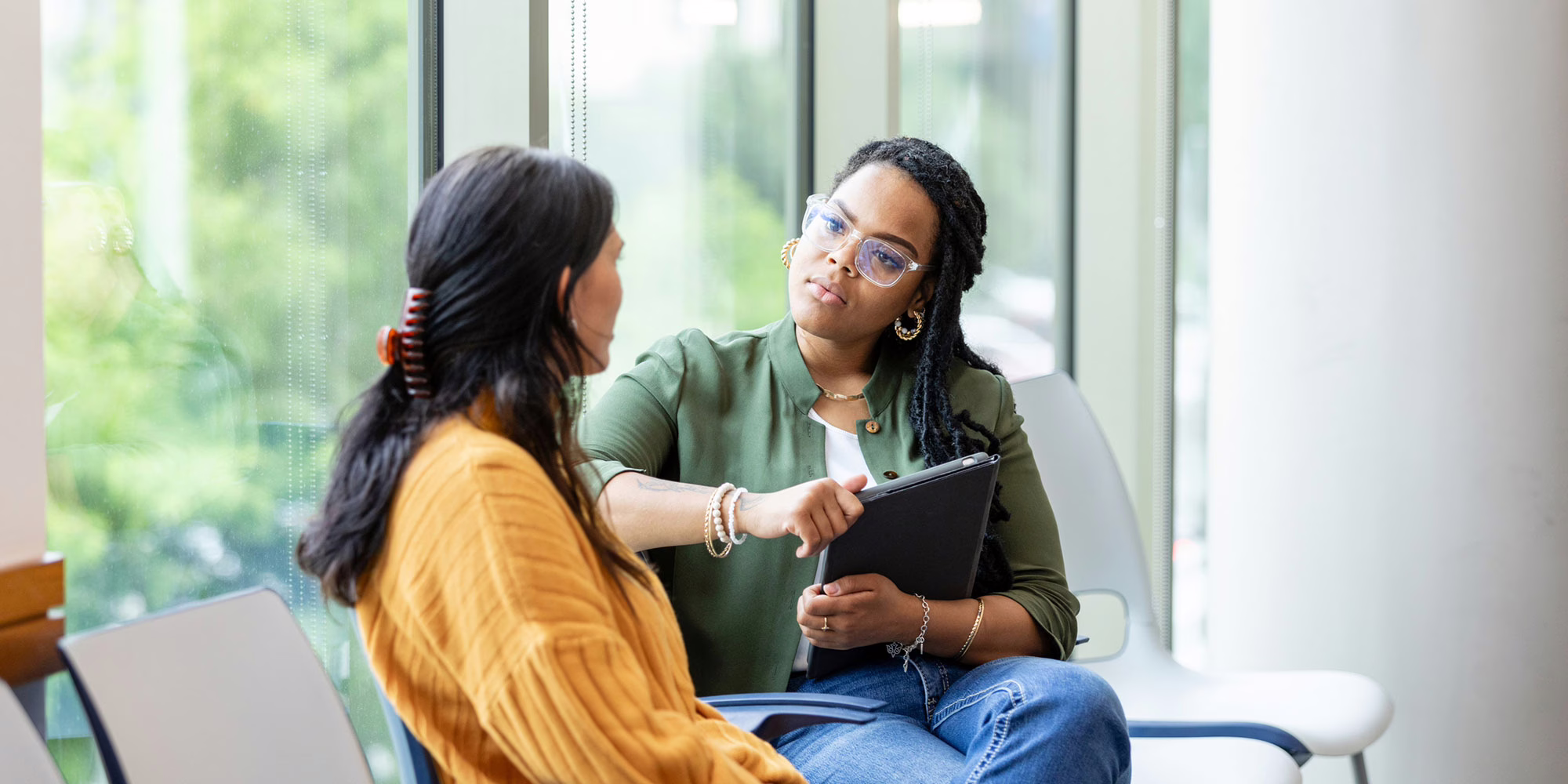mental health counselor with patient in office