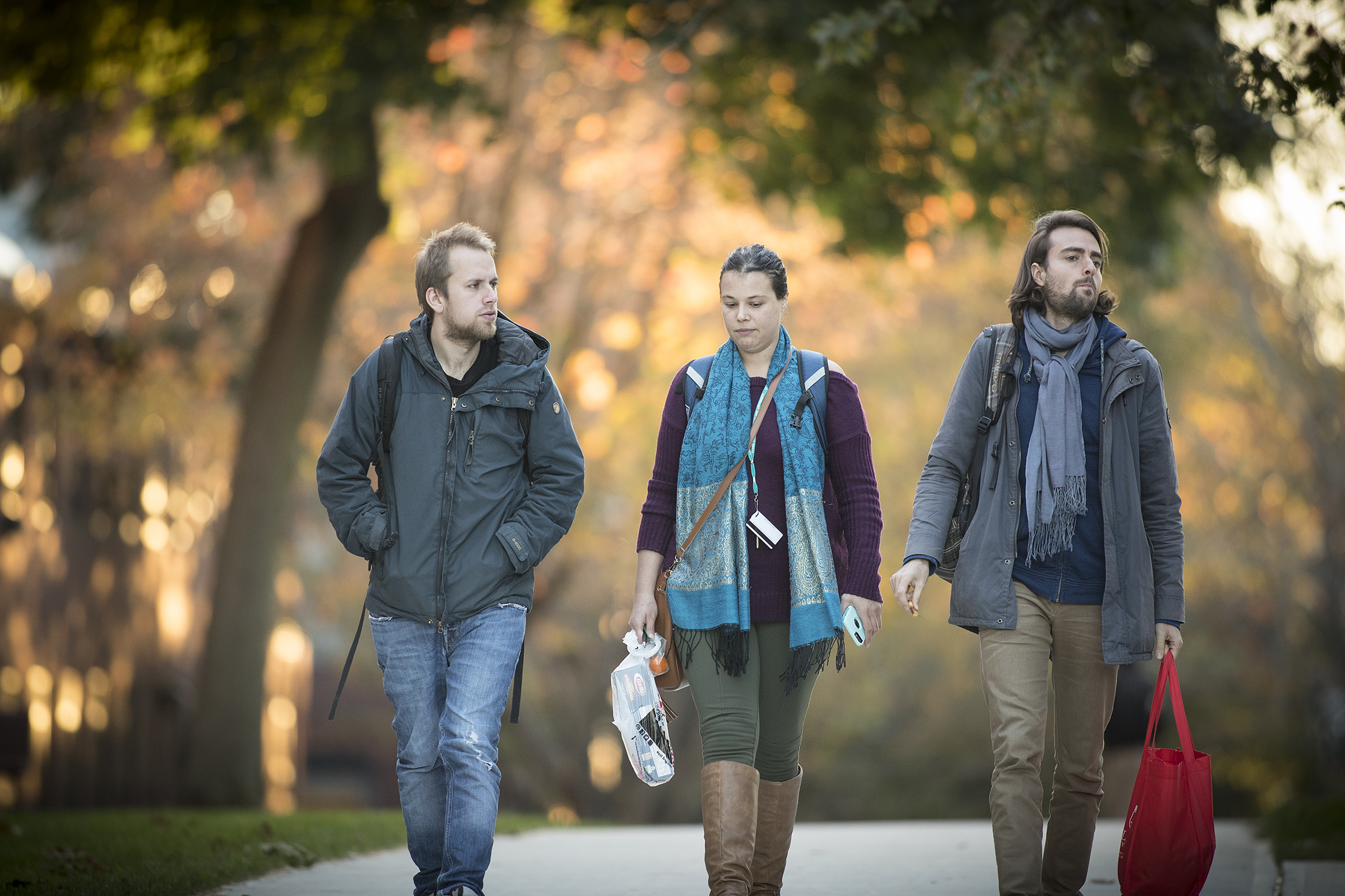 graduate students walking across campus