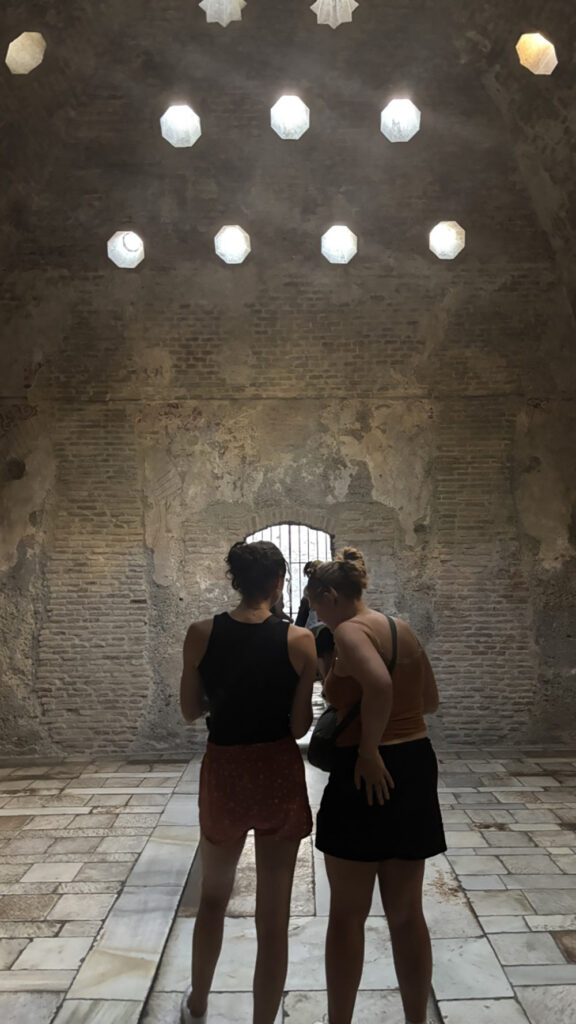 Clark students visit an old bathhouse in Seville, Spain