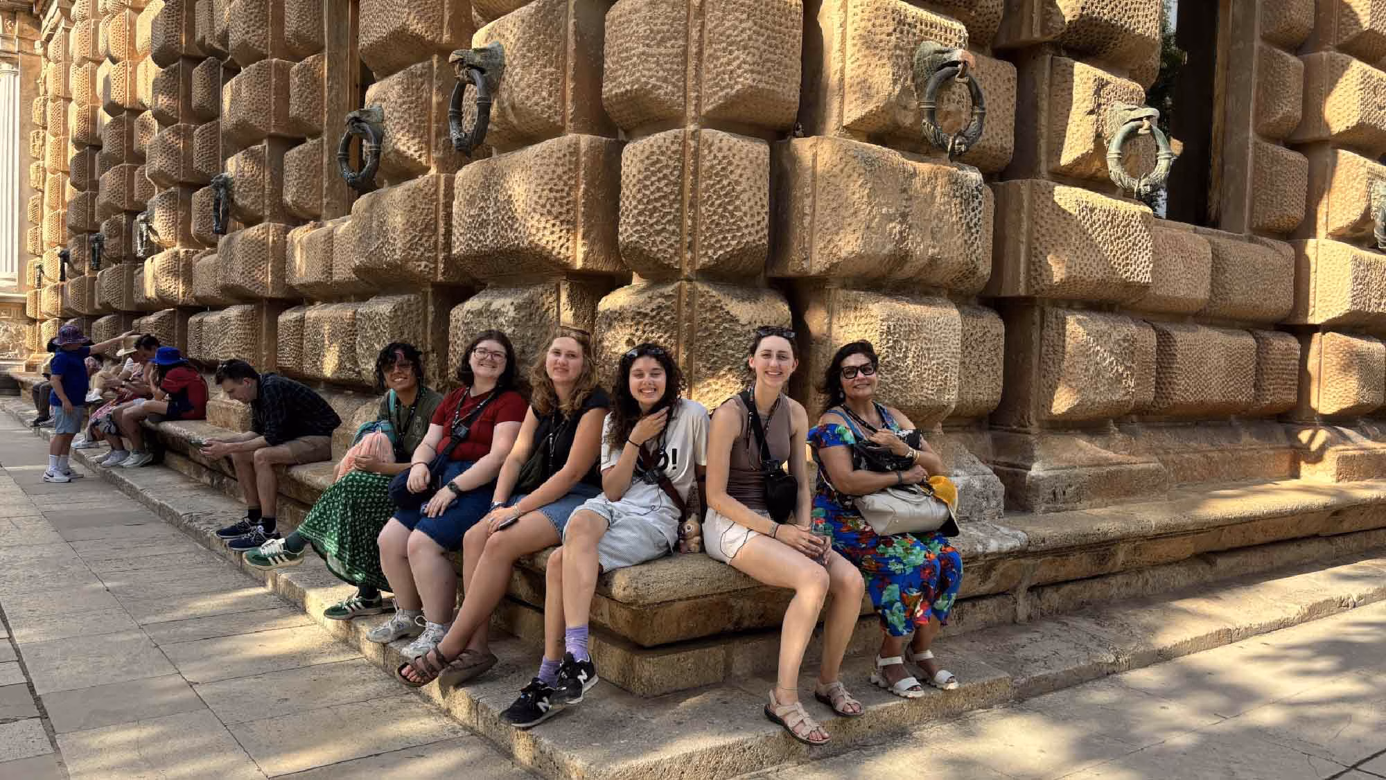 Students taking the Leir course at the Alhambra rest after a tour of the Alhambra, Spain
