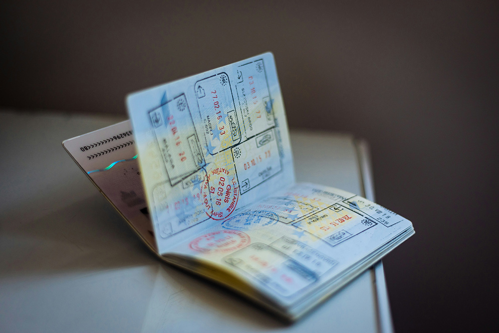 Passport open with several stamps visible