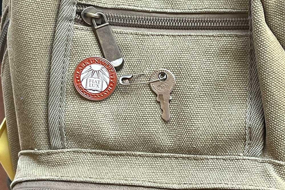 Close up of a backpack with a Clark pin attached