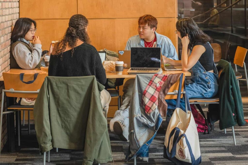 students collaborate in the library