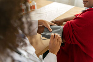 Nurse taking blood pressure test