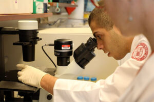 Student using microscope