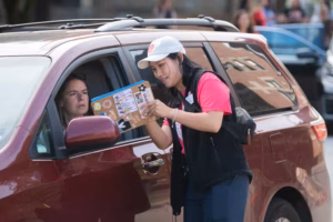 a motorist gets directions from a Clark guide