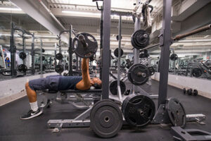 Student lifting weights