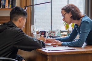 Professor working with student