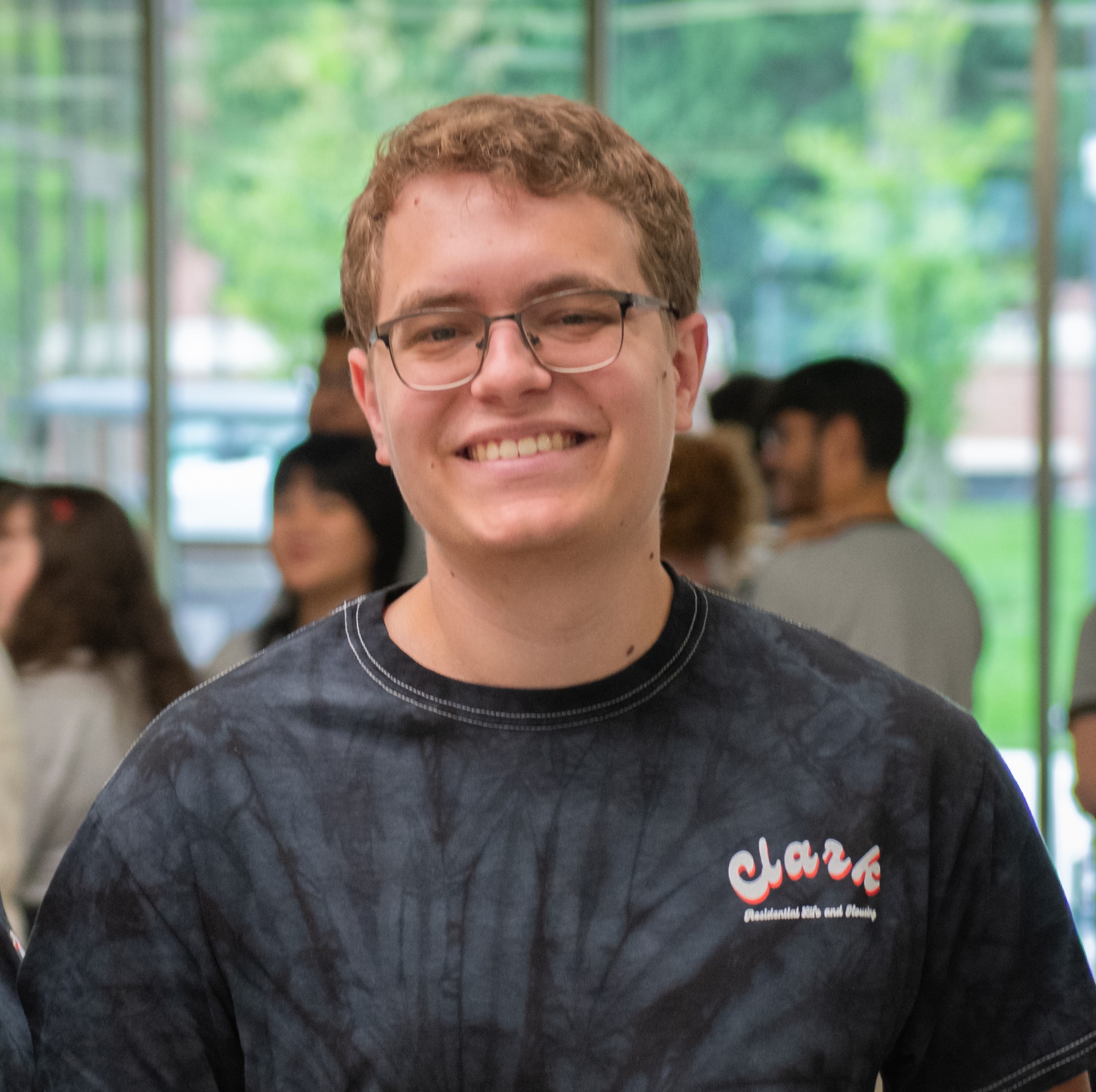 A photo Michael Giusti wearing a tie-dye shirt