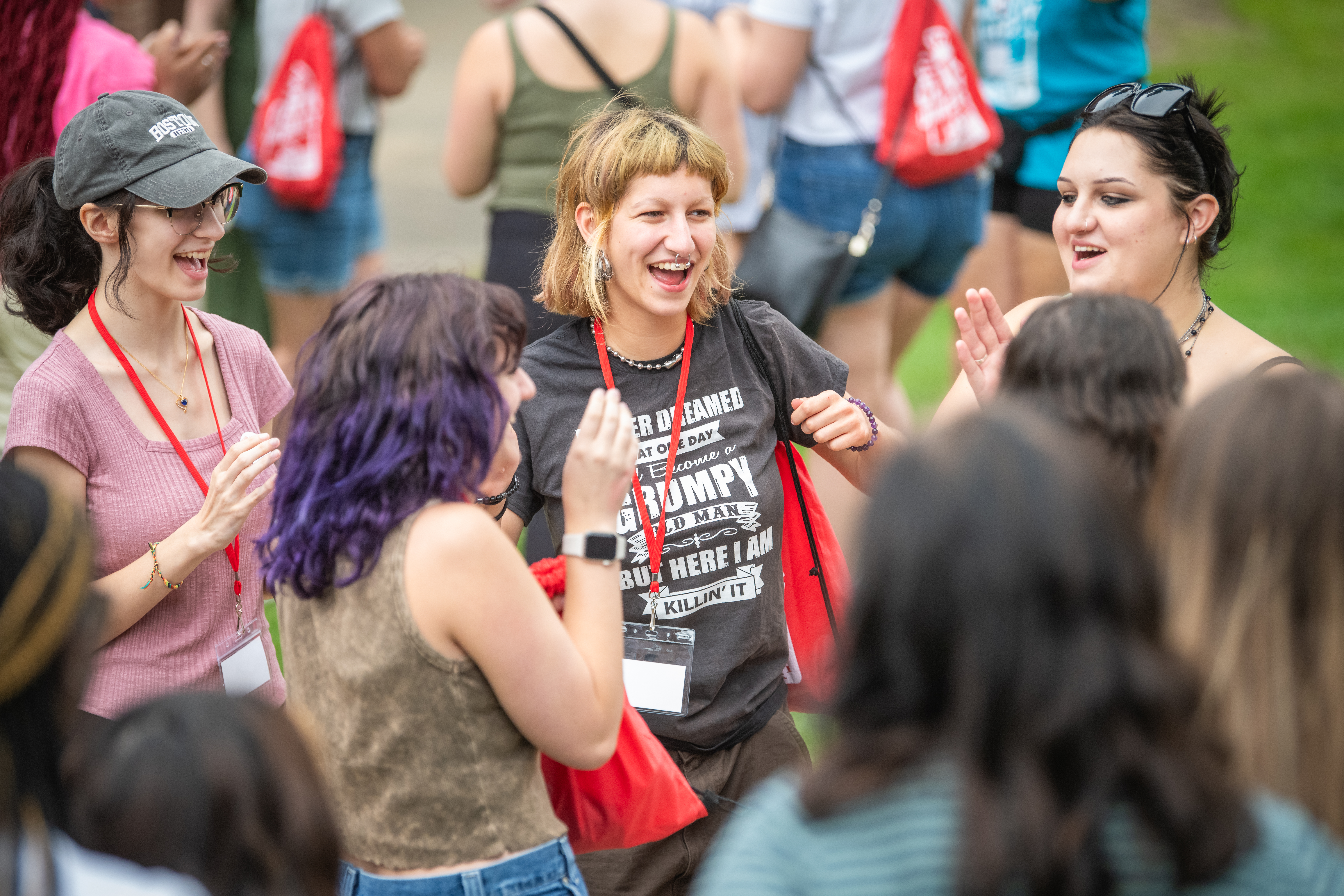 A group of students laughing at orientation