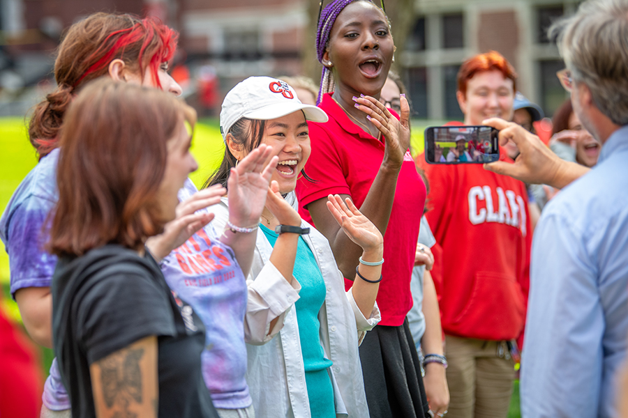 students waving at camera