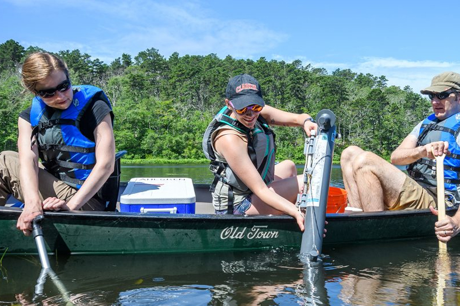 Steinbrecher Fellowship students collecting samples from pond