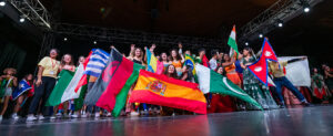 students holding flags of many nations