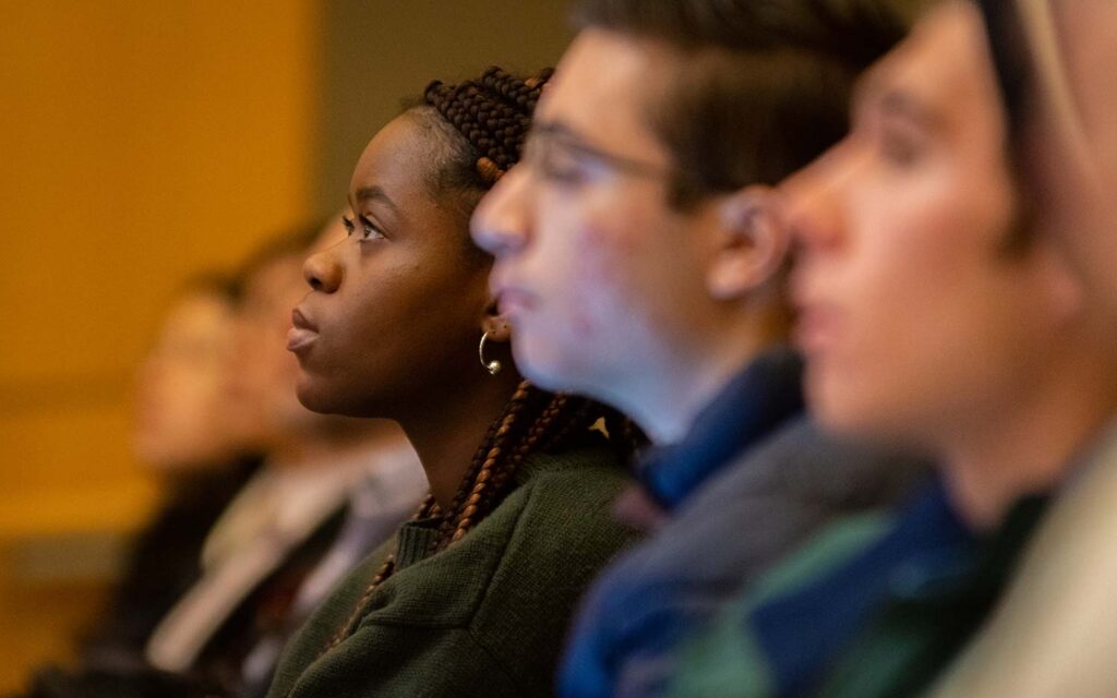 Students attending a lecture by Nestor Ramos