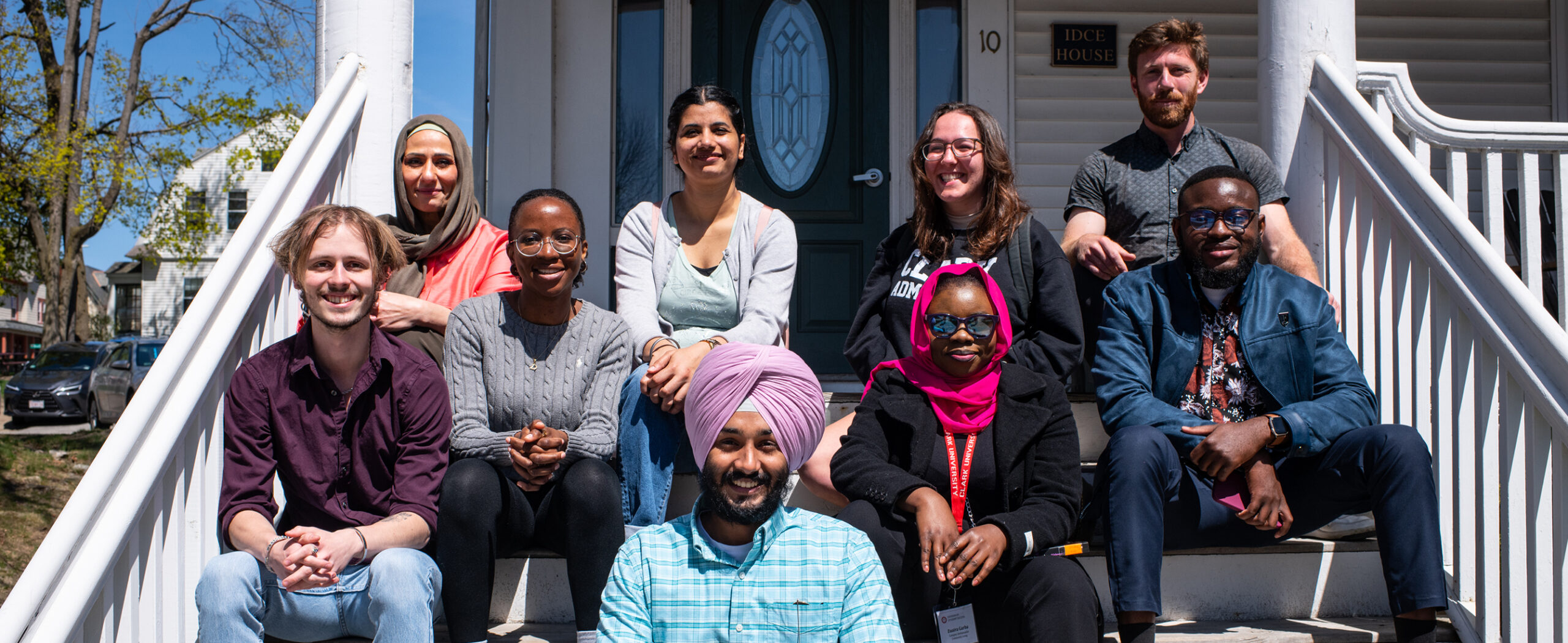 Group of SSJ students in front of IDCE house