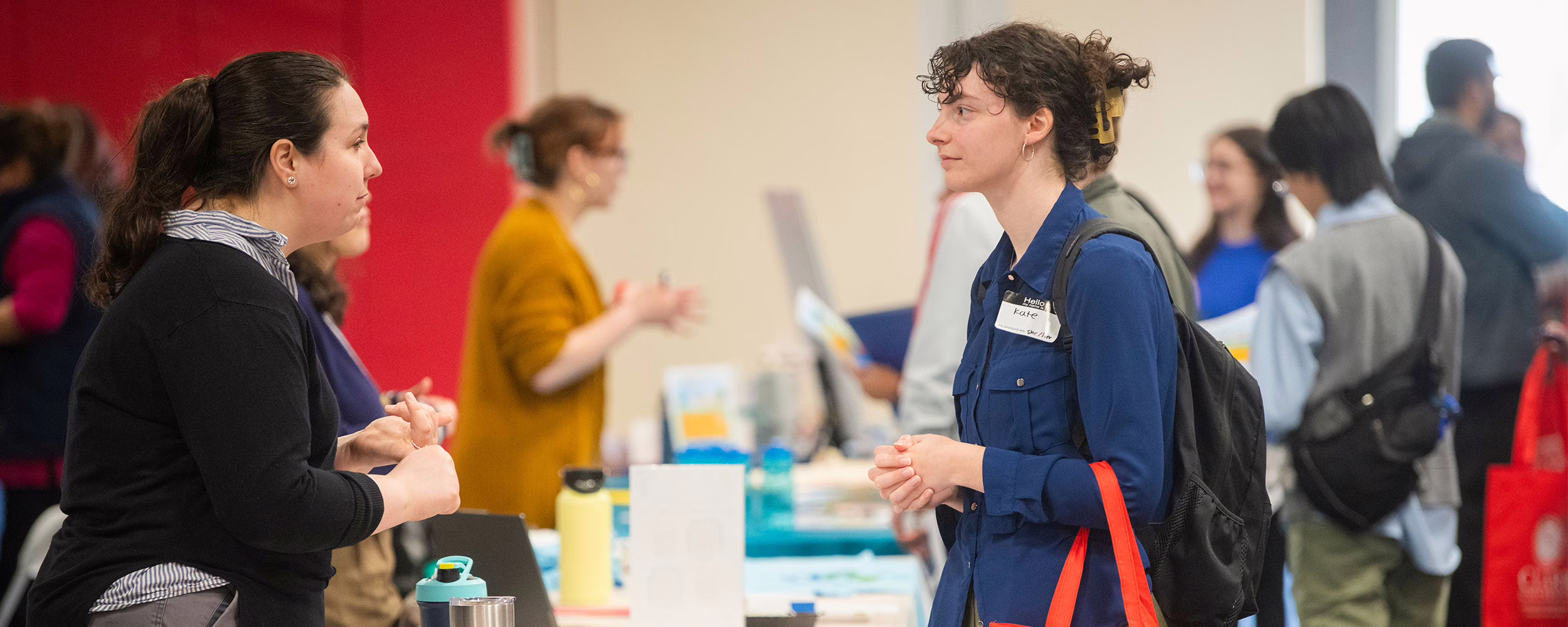 Student talking to employer at career fair