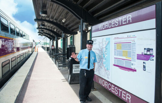 Train conductor waving