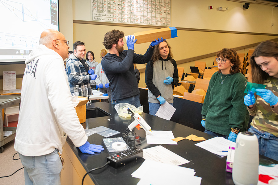 professor in physics class with students 