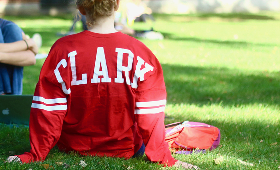 a student on the quad wearing a Clark shirt