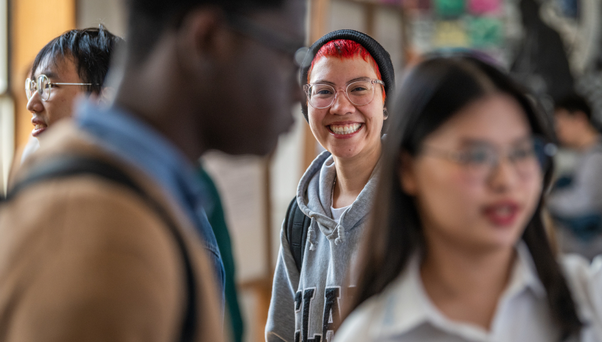 Student smiling at academic fair