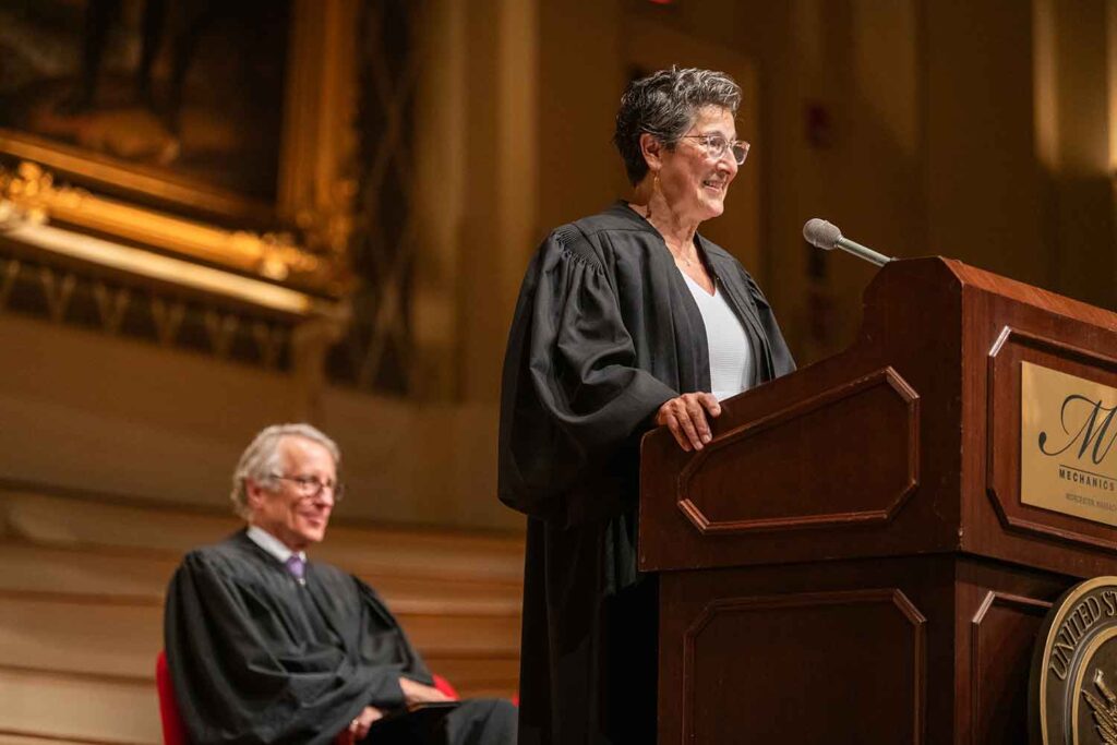 Margaret Guzman ’89 speaking at her swearing in as a United States District Court Judge