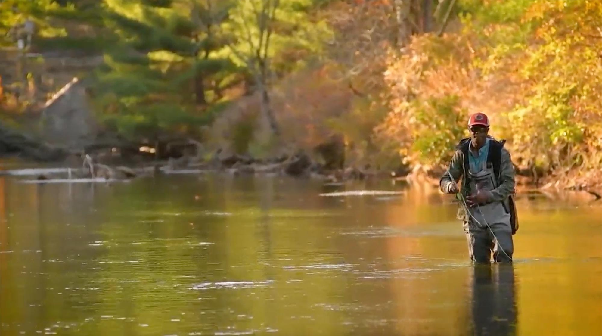 Still image for ambient video of Quincy Milton III ’20 fly fishing near the Clark Campus