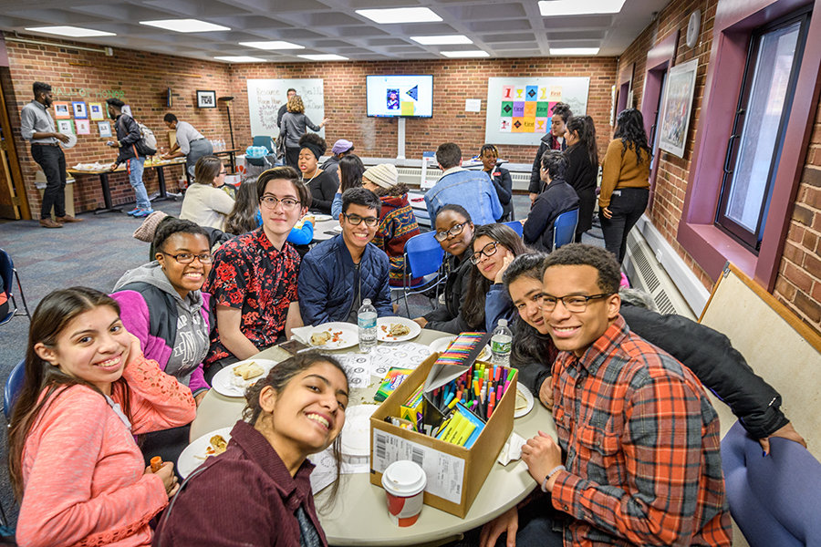 students eating pizza with marker and pencils drawing