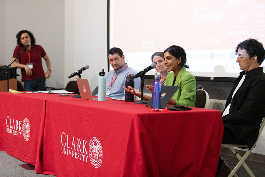 conference with people sitting at table speaking