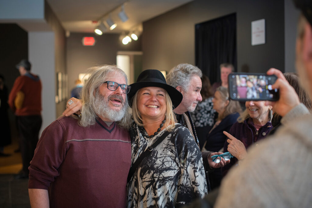 event with people smiling for camera