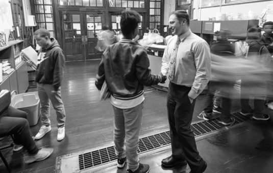 Student and principal in University Park Campus School hallway