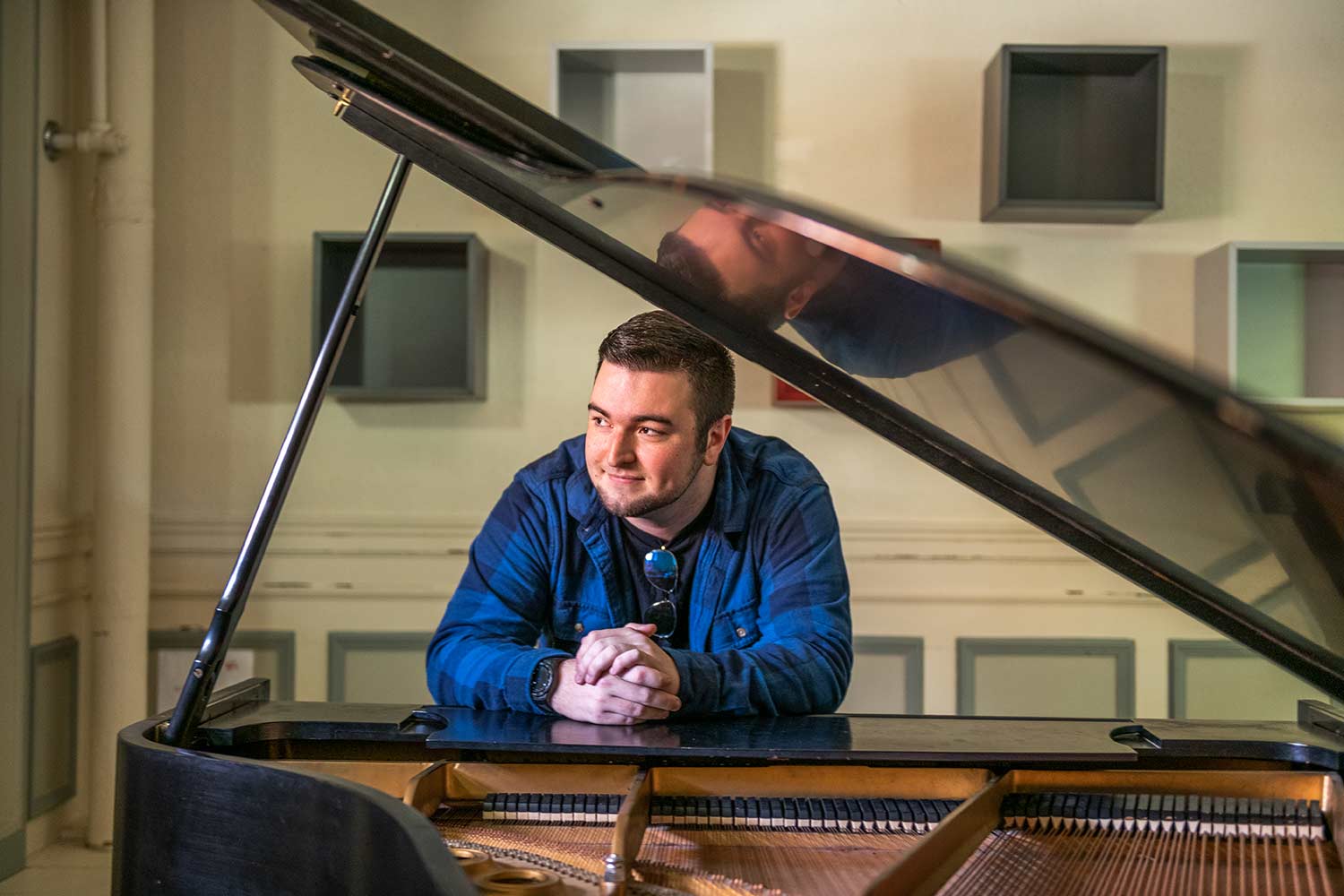 Music student, Channing Webber takes a break from practicing piano in a practice space, Estabrook Hall, Clark University