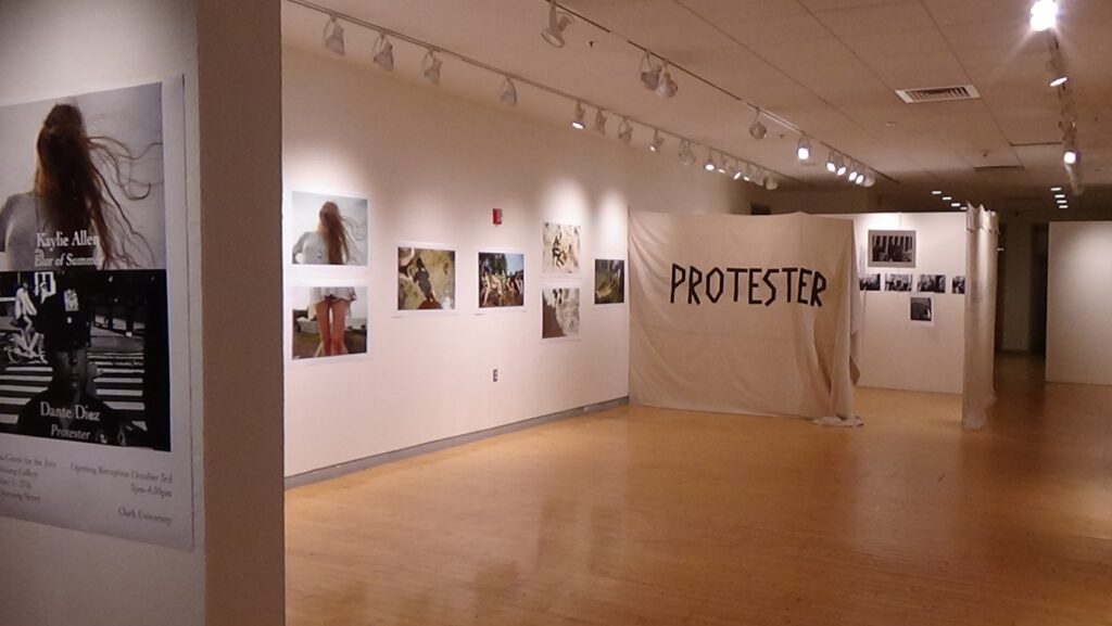 Gallery view of the joint exhibition, Kaylie Allen: Blur of Summer / Dante Diez: Protester, Shiltkamp Gallery, Clark University