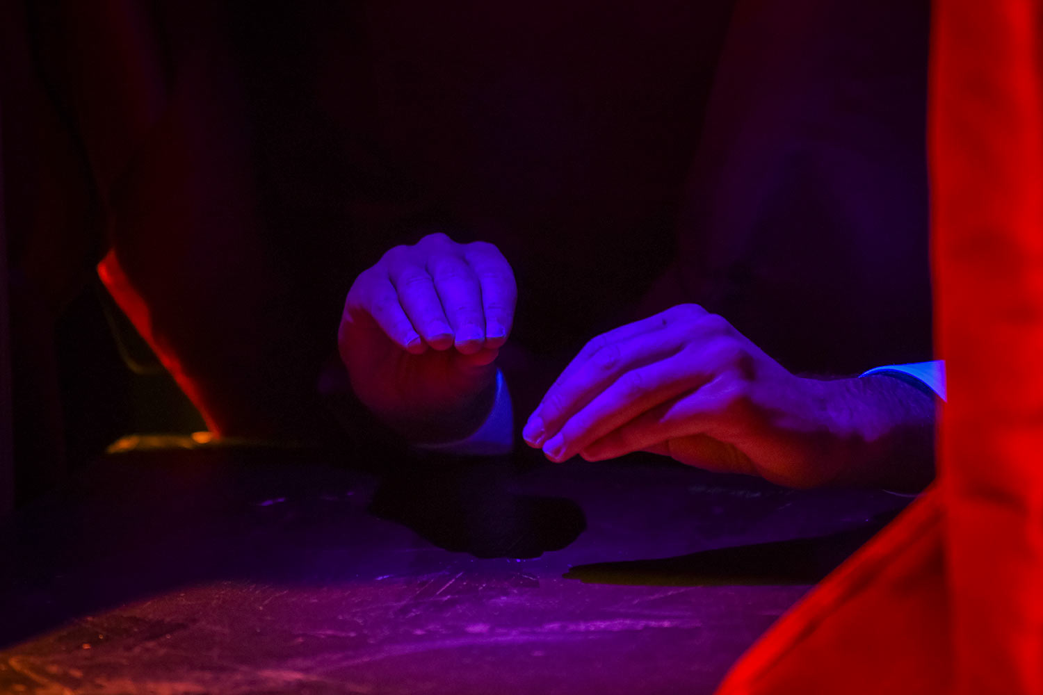A student's hands, dress rehearsal for Hacker’s Ostracon: An Interactive Performance