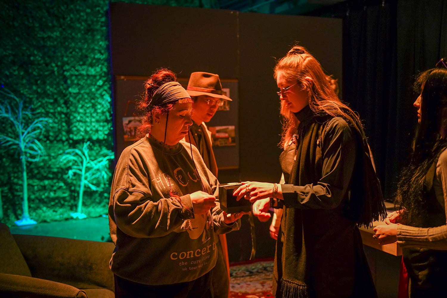 A student interacts with interactive media professor, Ulm , dress rehearsal for Hacker’s Ostracon: An Interactive Performance
