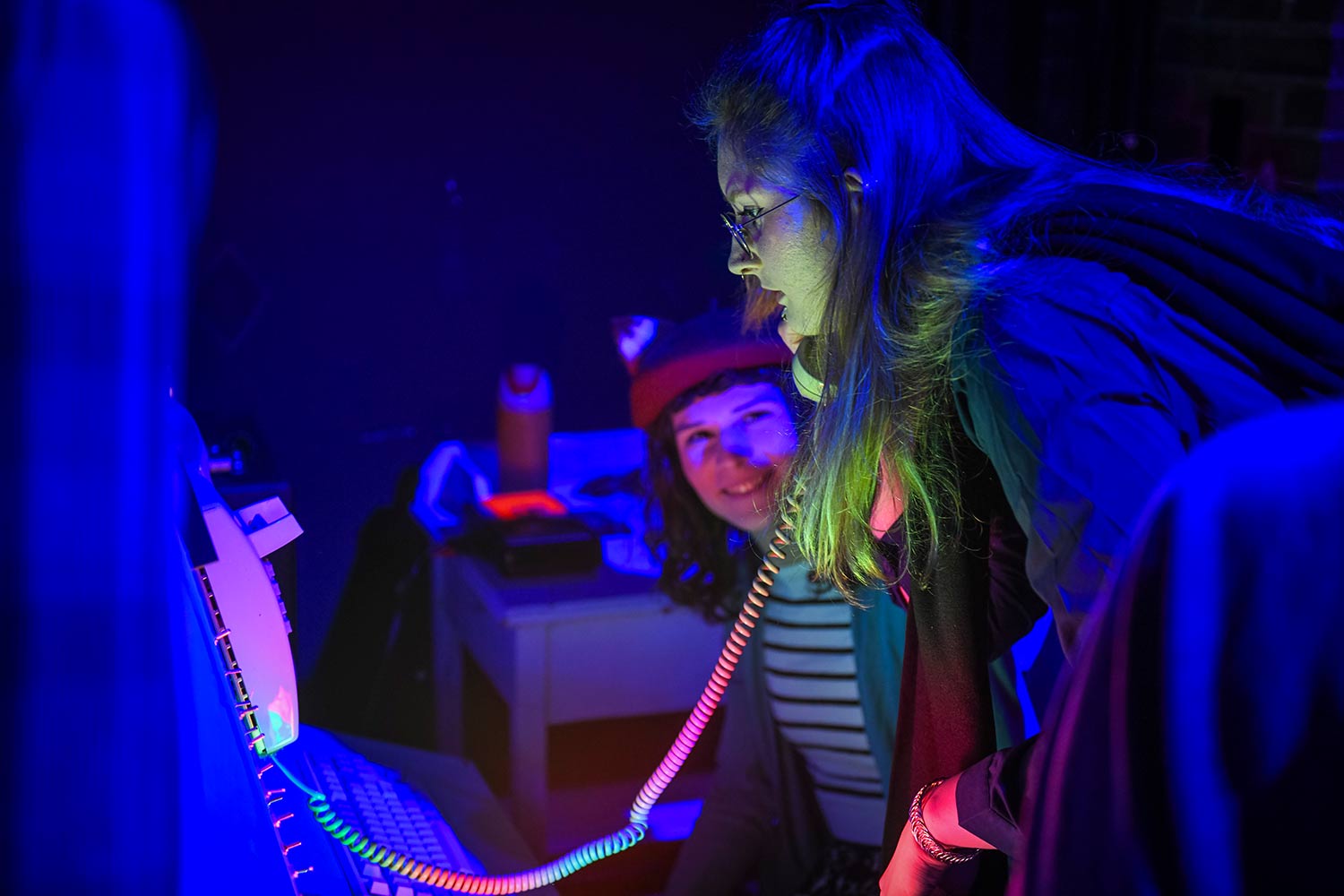 A student speaks on a phone, dress rehearsal for Hacker’s Ostracon: An Interactive Performance