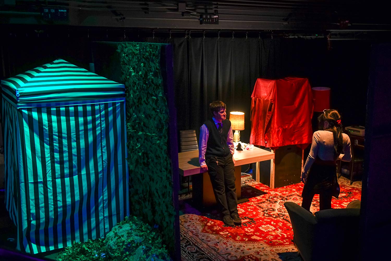 Students relax on the set, dress rehearsal for Hacker’s Ostracon: An Interactive Performance