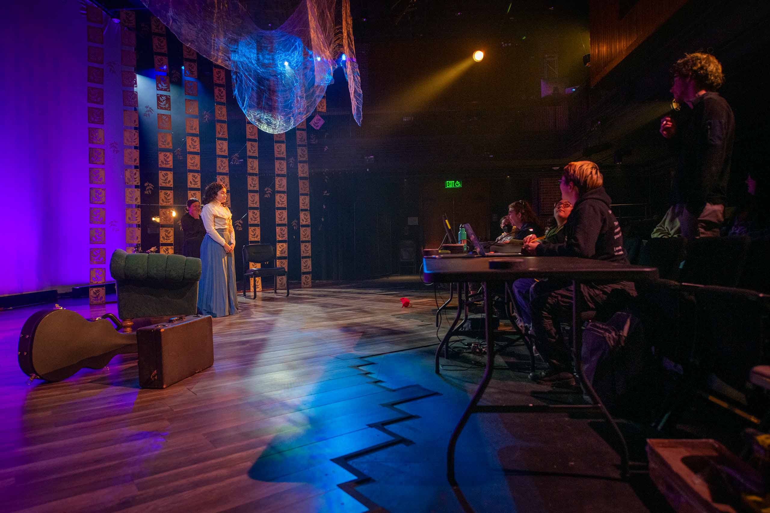 Student performing on stage, Clark University