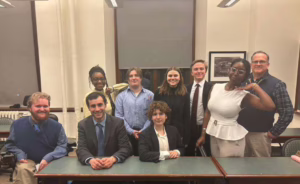 team poses for photo