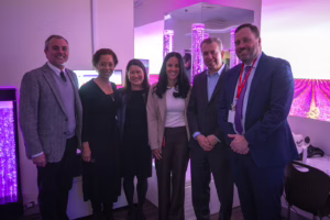 Aaron Haddock, director of behavioral health initiatives and programs at the Mosakowski Institute for Public Enterprise at Clark University, Nadia Ward, project co-director and executive director of the Mosakowski Institute, Amie Shei, president and CEO of The Health Foundation of Central Massachusetts, Stefania Doucette, principal of Southbridge High School, DESE Commissioner Pedro Martinez, and Bill Metzger, receiver/superintendent of Southbridge Public Schools, in the Sensory Immersion Room at Southbridge High School on March 3.