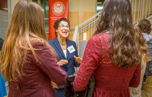 Female professor talking to students