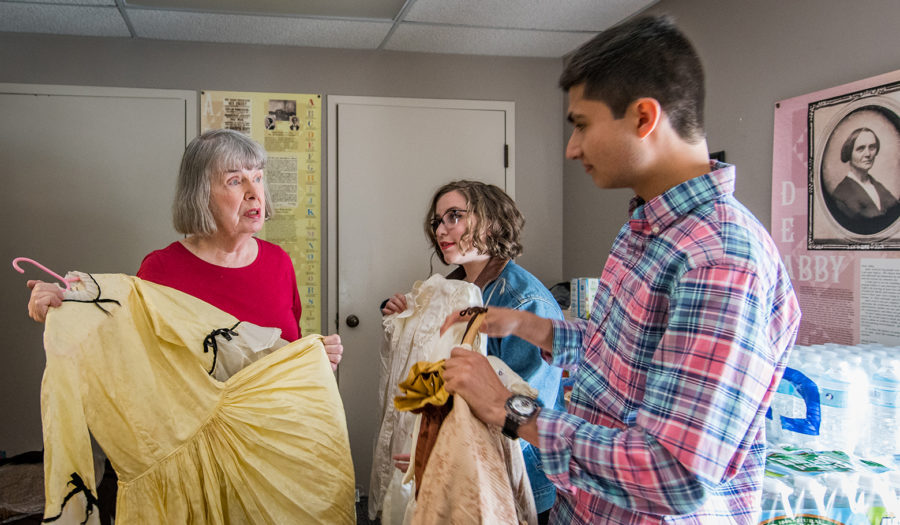 Professor holding garbage back with students