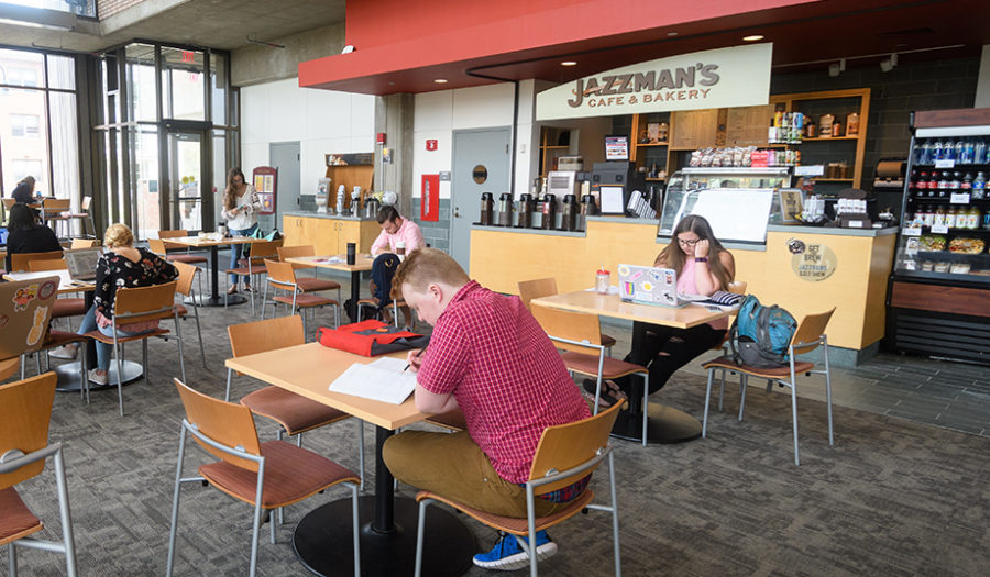 shot of students sitting at Jazzman restaurant tables