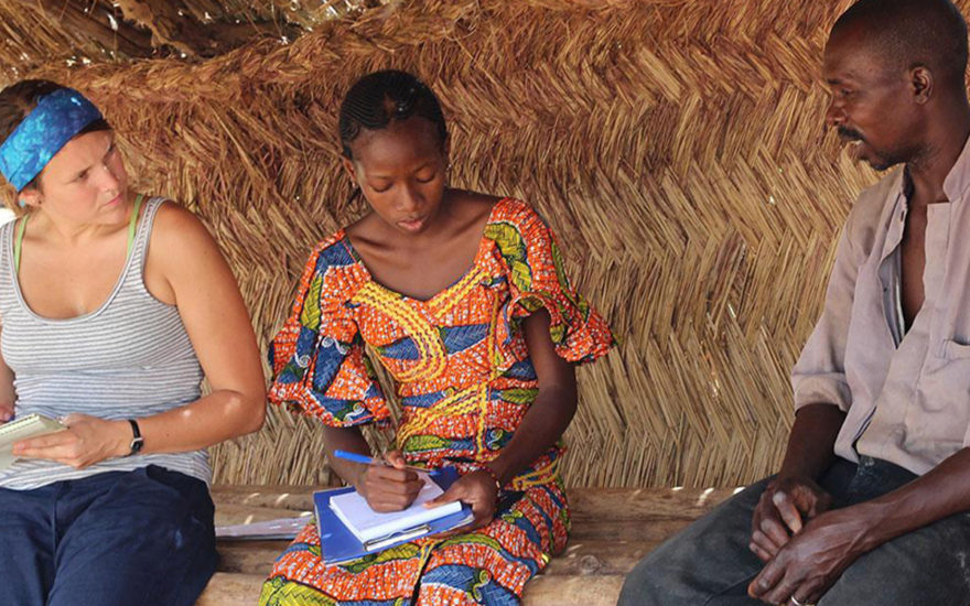 Two researchers interviewing local resident