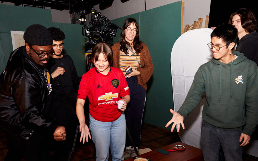 screen studies students playing rock, paper, scissors game